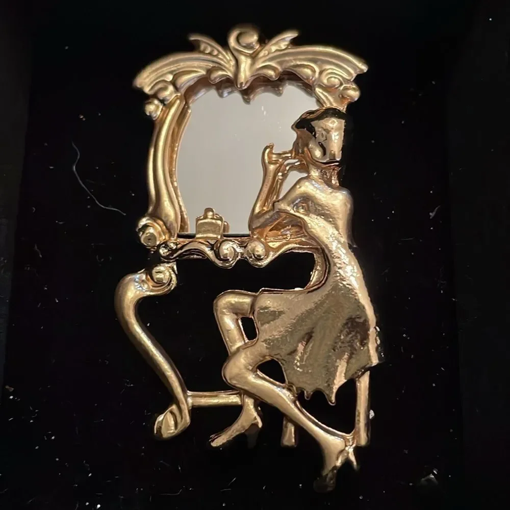 REFLECTION IN MIRROR BROOCH‎